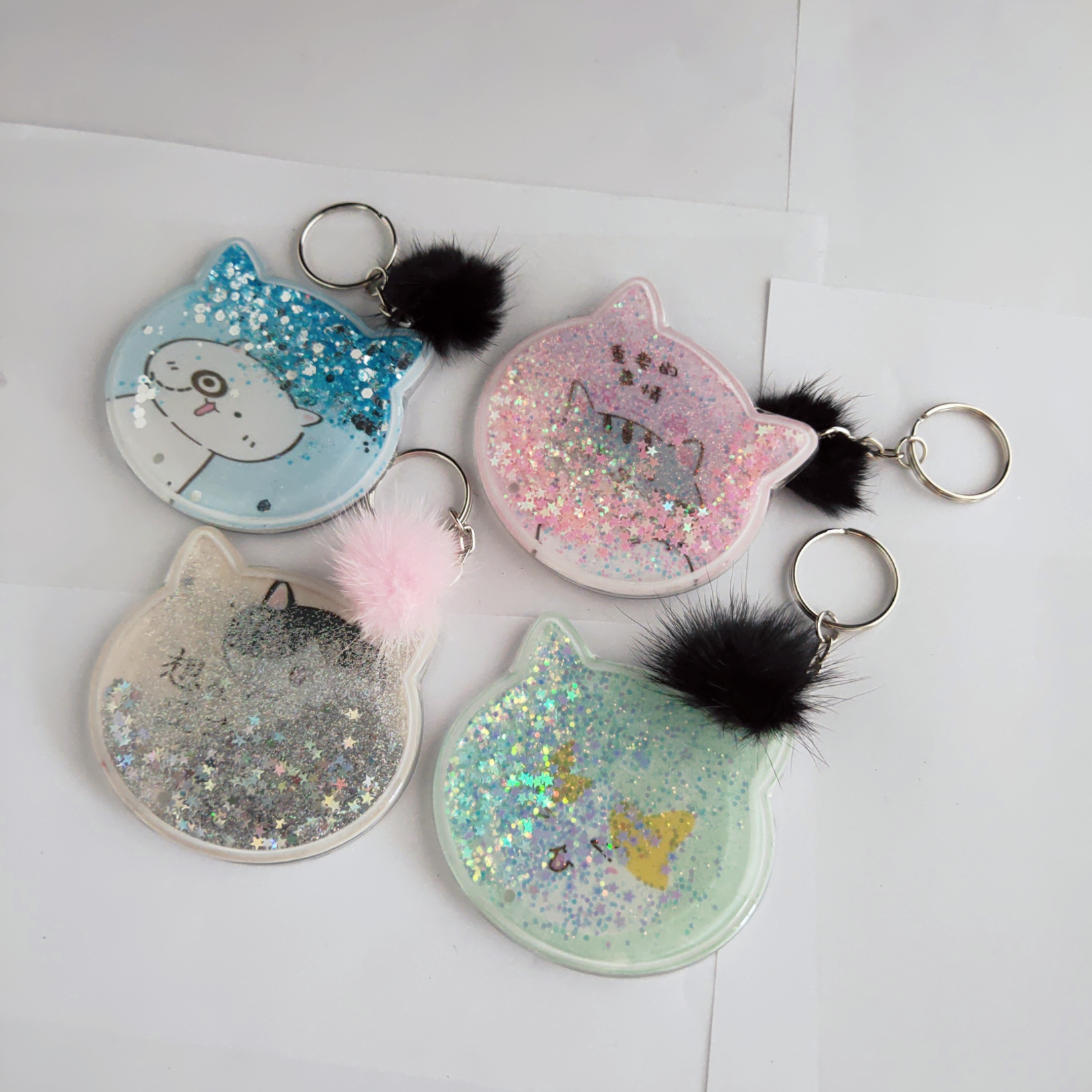 Floating sparkle glitter one side mirror in cat head shaped with Pompom hariball keychain for wedding gifts